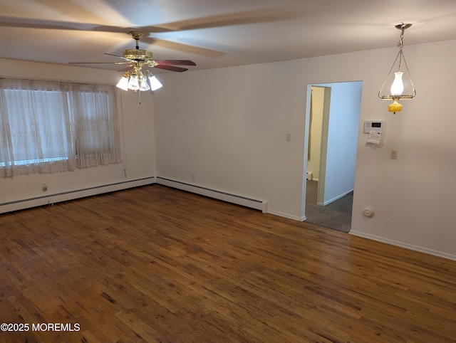 spare room featuring ceiling fan, a baseboard radiator, and dark hardwood / wood-style flooring