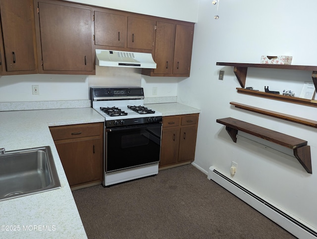 kitchen featuring sink, range with gas stovetop, baseboard heating, and dark carpet