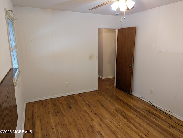 spare room with ceiling fan and hardwood / wood-style floors