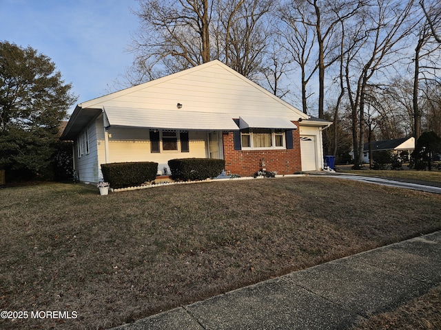 ranch-style home with a garage and a front lawn