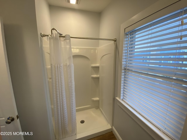 bathroom featuring a shower with curtain