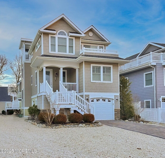 view of front facade featuring a garage and covered porch