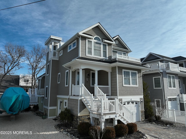 view of front of home featuring a garage and a porch