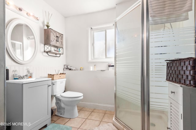 bathroom with tile patterned floors, toilet, an enclosed shower, and vanity