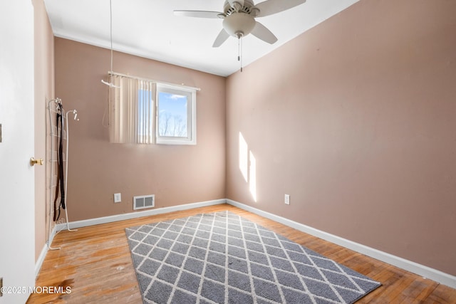 unfurnished room featuring ceiling fan and hardwood / wood-style floors