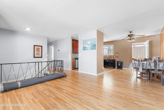 interior space featuring ceiling fan and light hardwood / wood-style flooring