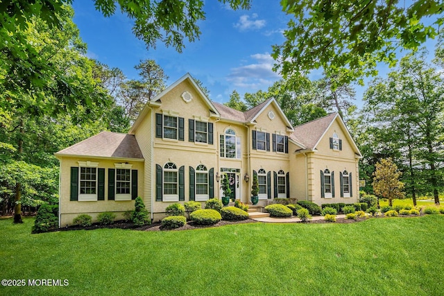 colonial home with a front yard