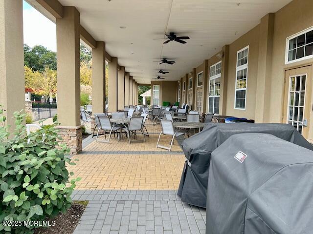 view of patio with area for grilling and ceiling fan