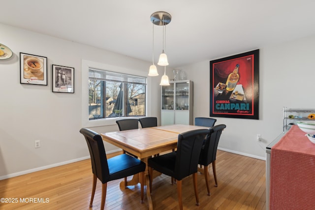 dining area featuring wood-type flooring