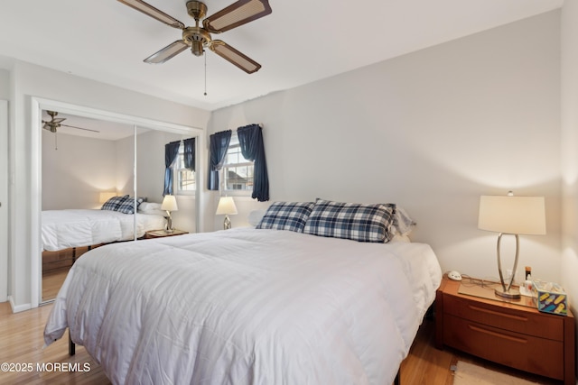 bedroom featuring ceiling fan, light wood-type flooring, and a closet