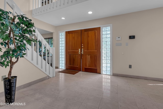 entrance foyer featuring light tile patterned flooring