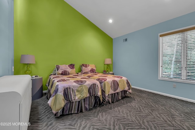 carpeted bedroom with vaulted ceiling