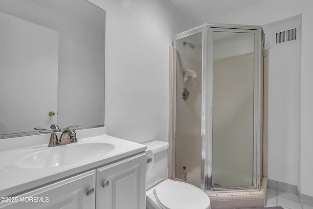 bathroom with vanity, an enclosed shower, tile patterned floors, and toilet