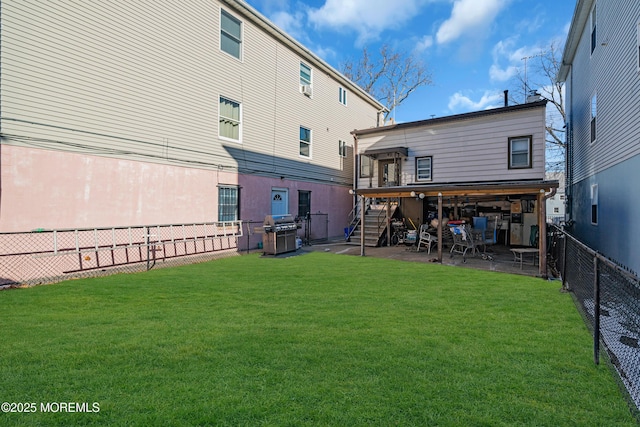 rear view of house with a yard