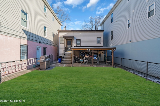 rear view of property with a yard