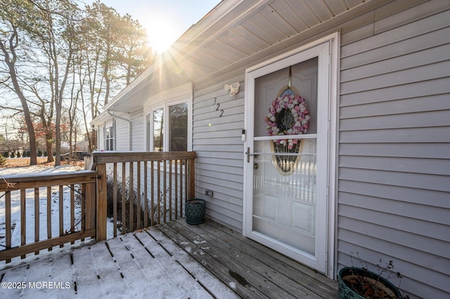 doorway to property featuring a wooden deck