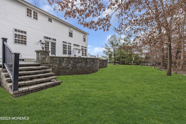 rear view of property with a lawn