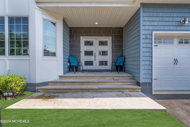 view of exterior entry featuring french doors