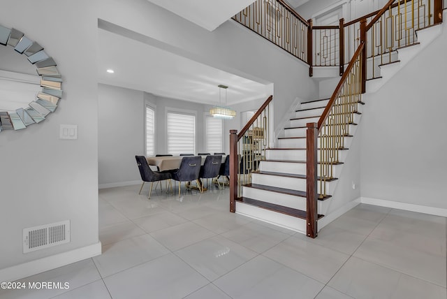 staircase with tile patterned floors