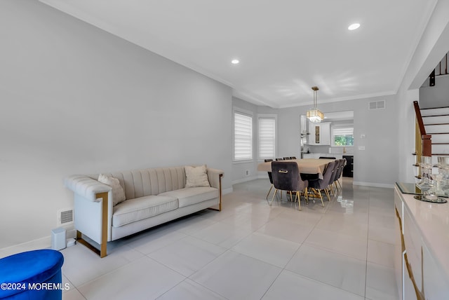 living room featuring crown molding and light tile patterned floors