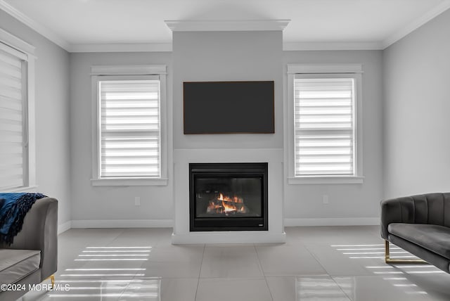 living room with light tile patterned floors, crown molding, and a wealth of natural light