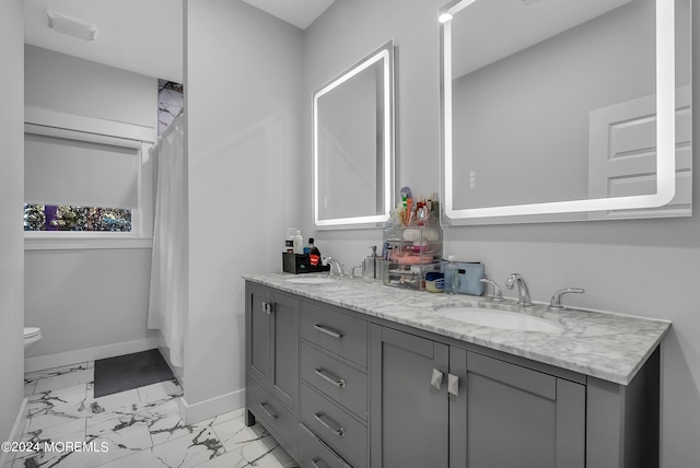 bathroom with vanity and toilet