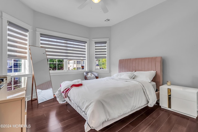 bedroom featuring ceiling fan and dark hardwood / wood-style floors