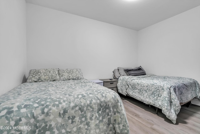 bedroom with light hardwood / wood-style flooring