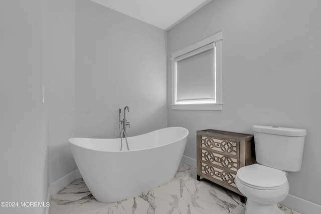 bathroom with toilet and a tub