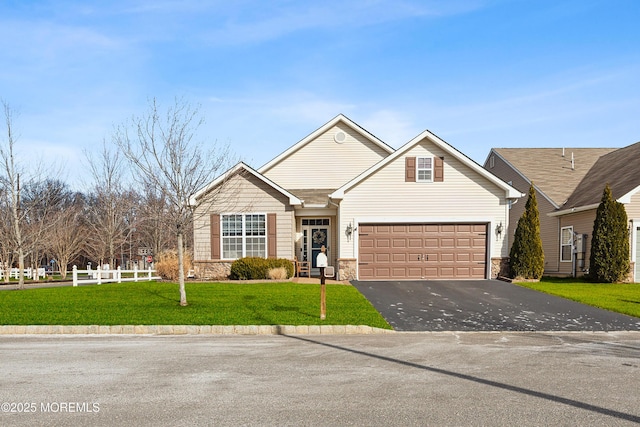 view of front facade with a garage and a front lawn