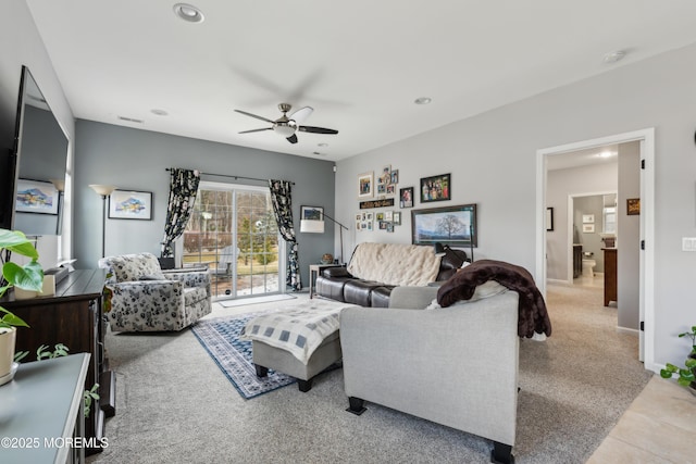 living room with light colored carpet and ceiling fan