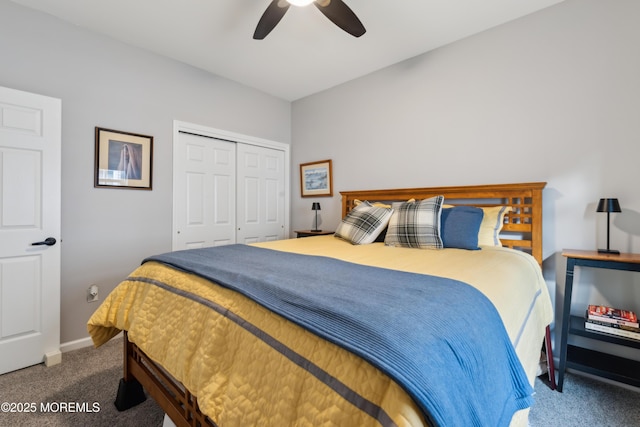 carpeted bedroom with ceiling fan and a closet