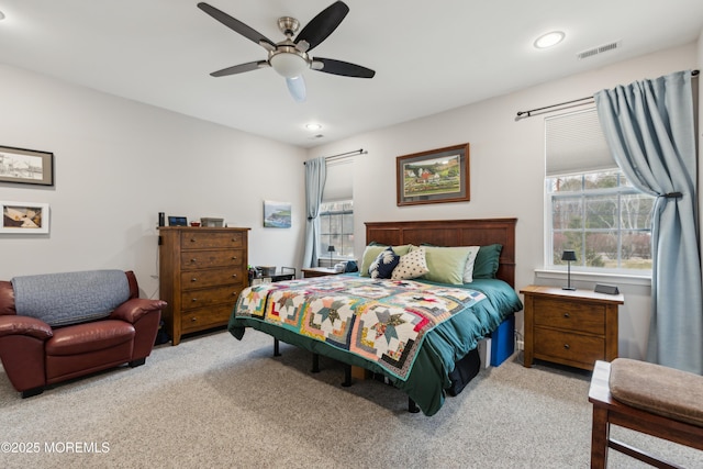 carpeted bedroom featuring ceiling fan