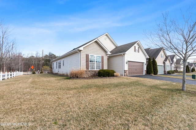 view of front of home with a garage and a front yard