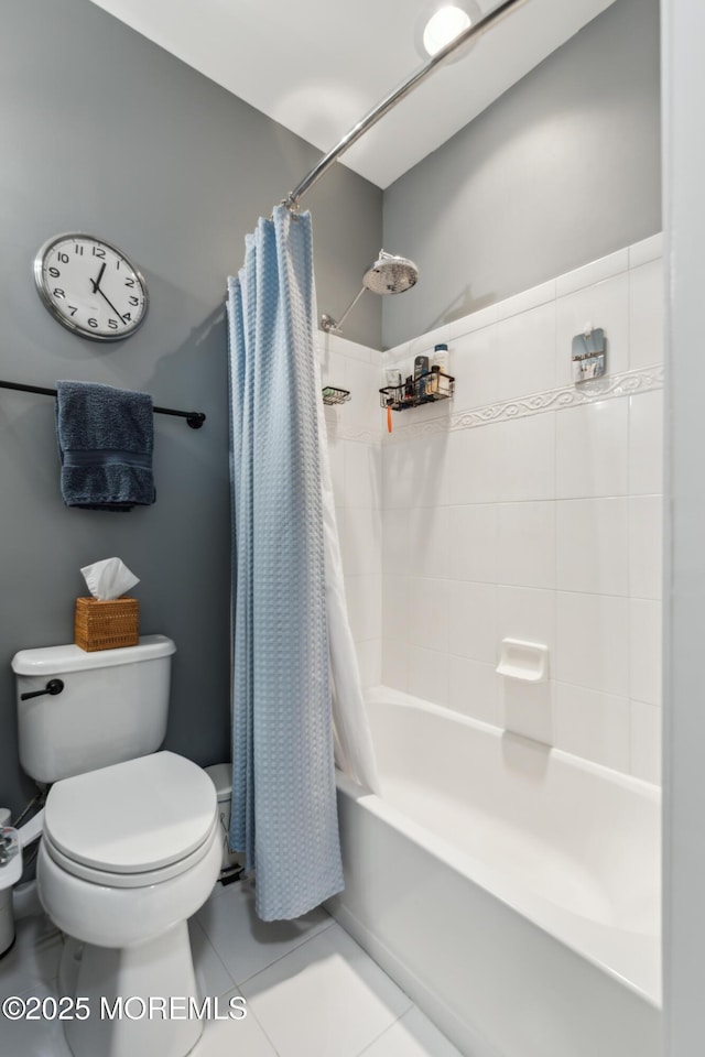 bathroom with tile patterned floors, toilet, and shower / bath combo