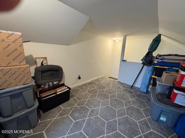107 Eagle Ridge Cir, Lakewood, NJ 08701 - living area with dark carpet and lofted ceiling