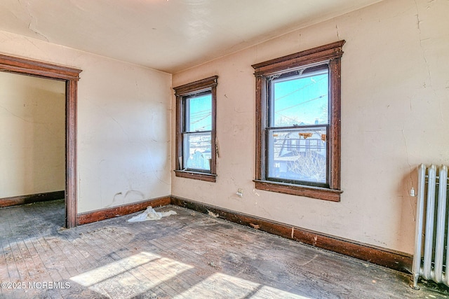 unfurnished room with radiator