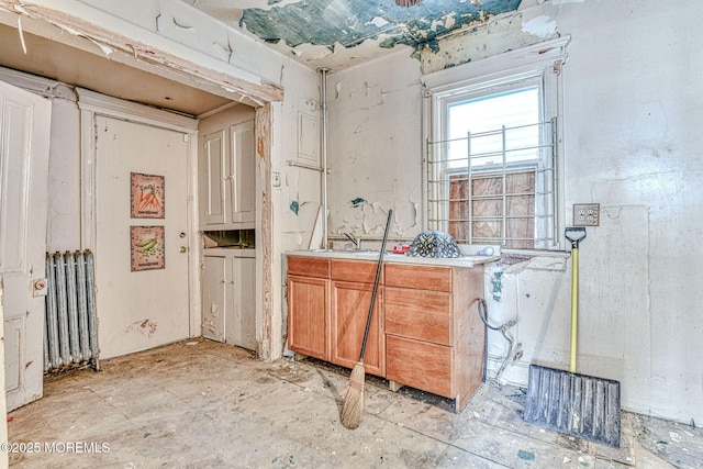 kitchen featuring sink and radiator heating unit