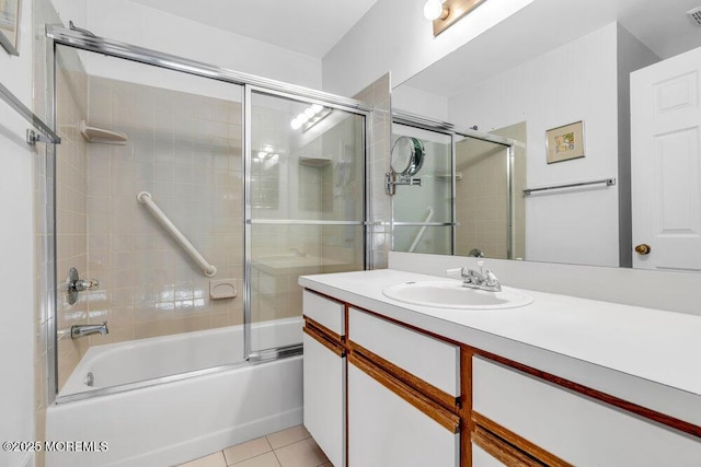 bathroom with vanity, tile patterned floors, and shower / bath combination with glass door