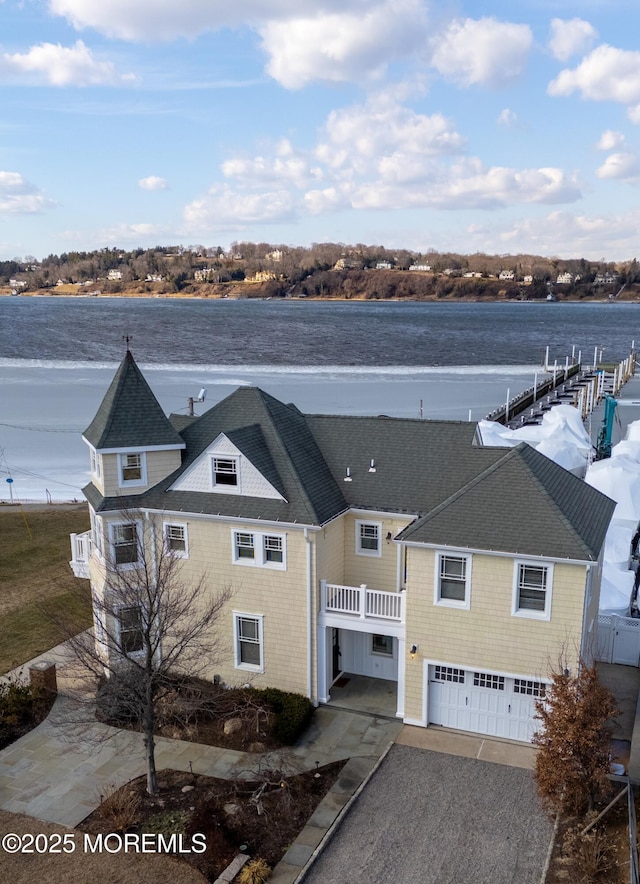 drone / aerial view with a water view