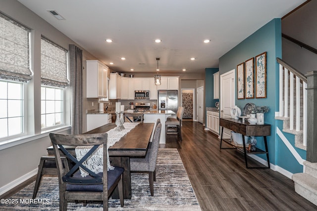 dining area featuring dark hardwood / wood-style flooring