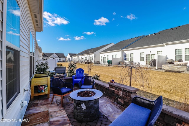 view of patio with a fire pit