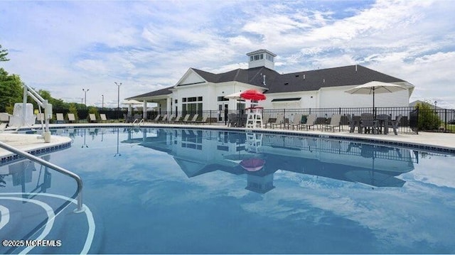 view of swimming pool with a patio