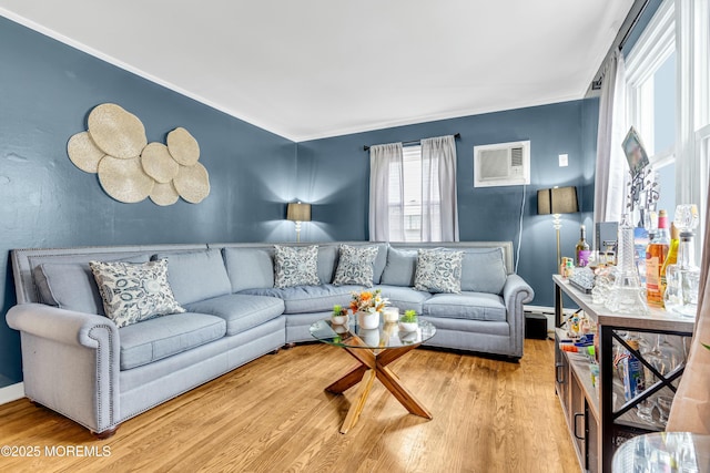 living room with wood-type flooring and a wall mounted AC