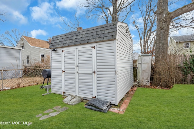 view of outbuilding featuring a yard