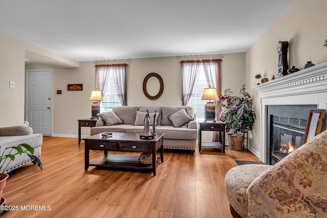 living room with plenty of natural light and light wood-type flooring