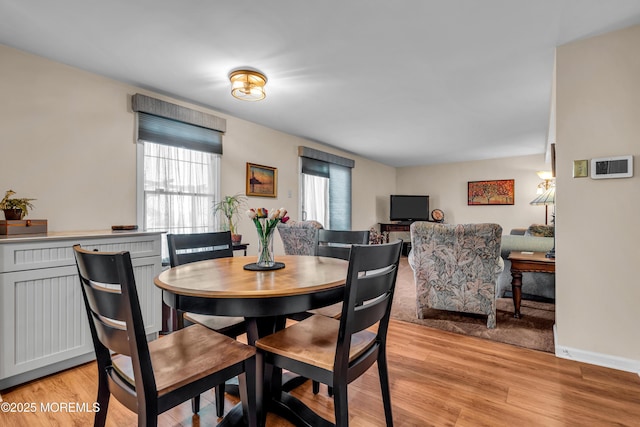 dining area featuring light wood-type flooring