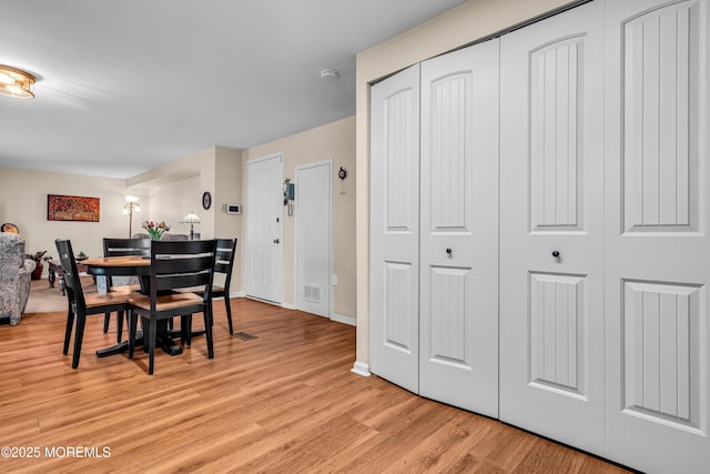 dining space featuring light hardwood / wood-style floors