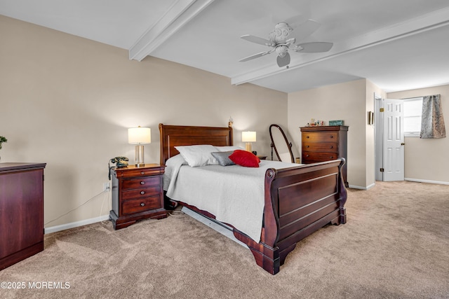 carpeted bedroom featuring ceiling fan and beam ceiling