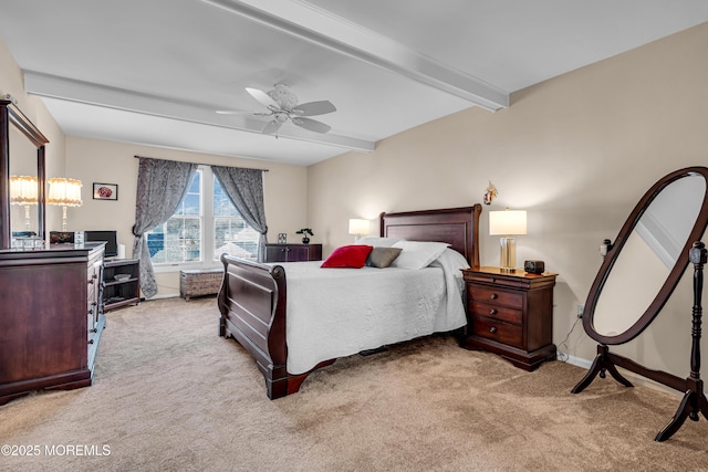 bedroom with ceiling fan, beam ceiling, and light carpet